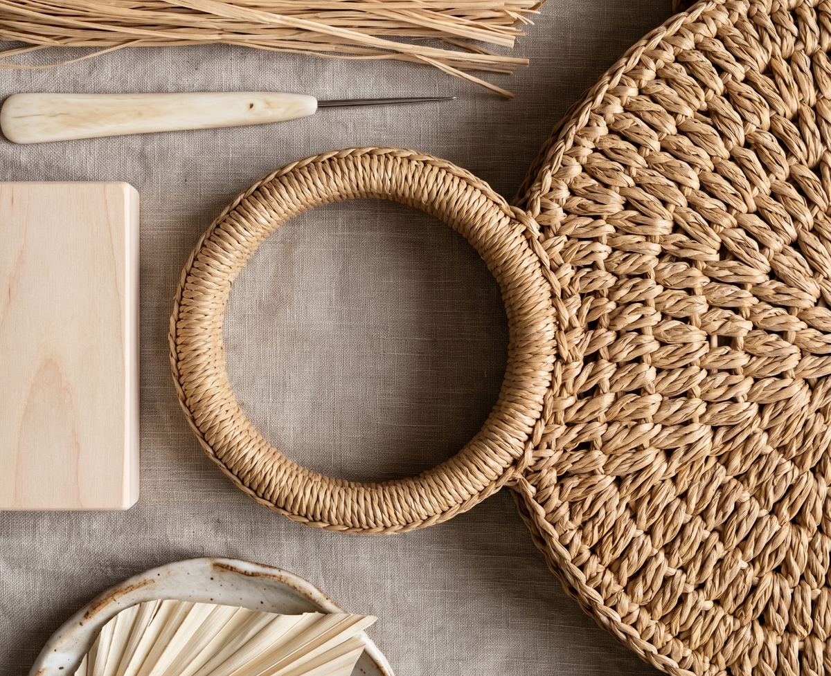 Woven basket, wooden block, and natural elements on a textured surface