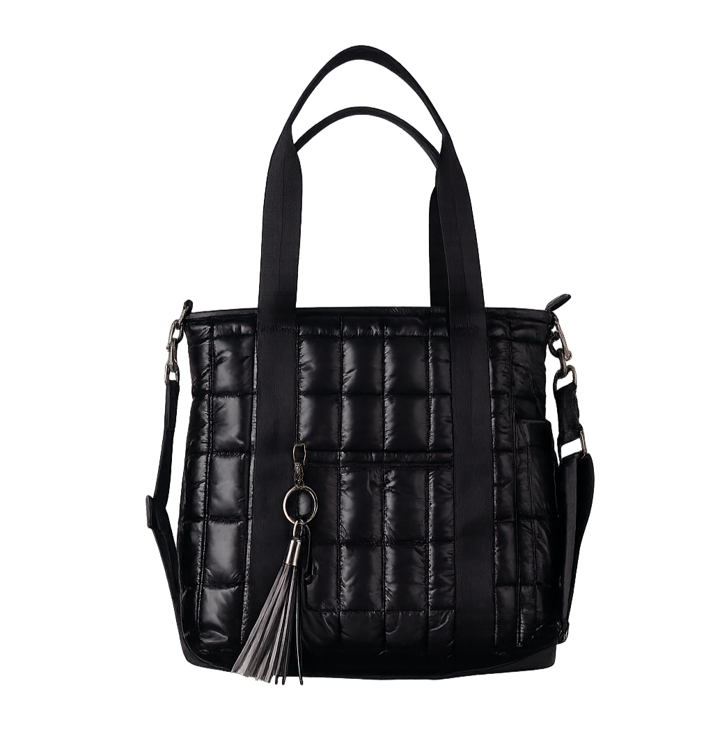 Black quilted handbag with a tassel on a white background