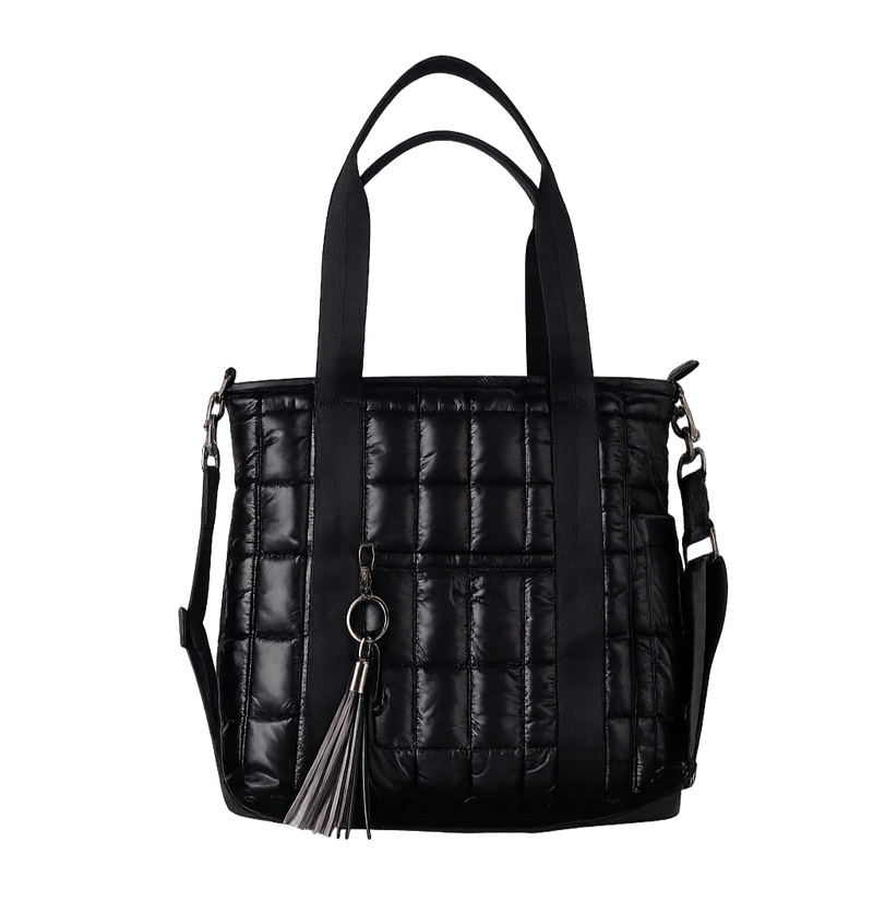 Black quilted handbag with a tassel on a white background