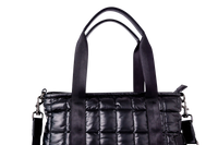 Black quilted handbag with a chain detail on a white background