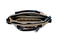 Gold and black puffer laptop tote with zippers on a white background