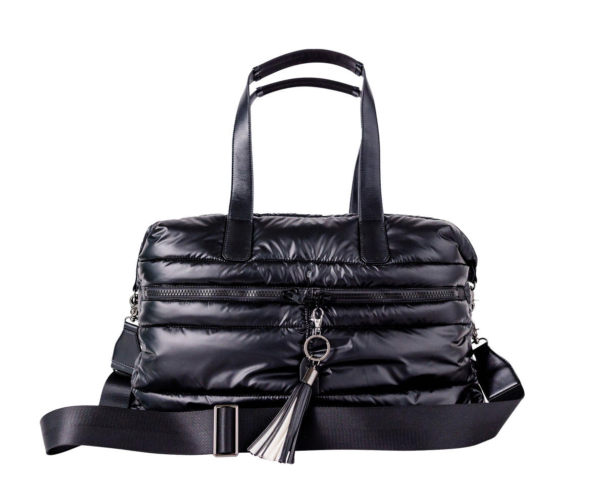 Black puffer weekender tote bag with a keychain on a white background