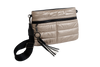 Beige quilted handbag with black strap and tassel on a white background