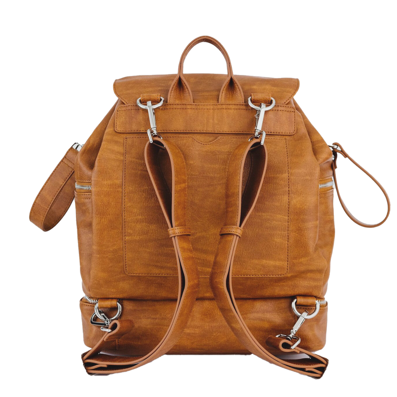 Brown vegan leather convertible backpack diaper bag with silver zippers on a white background