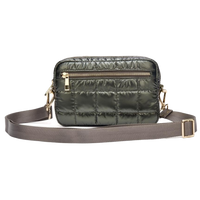 Green puffer crossbody tote with gold zippers on a white background