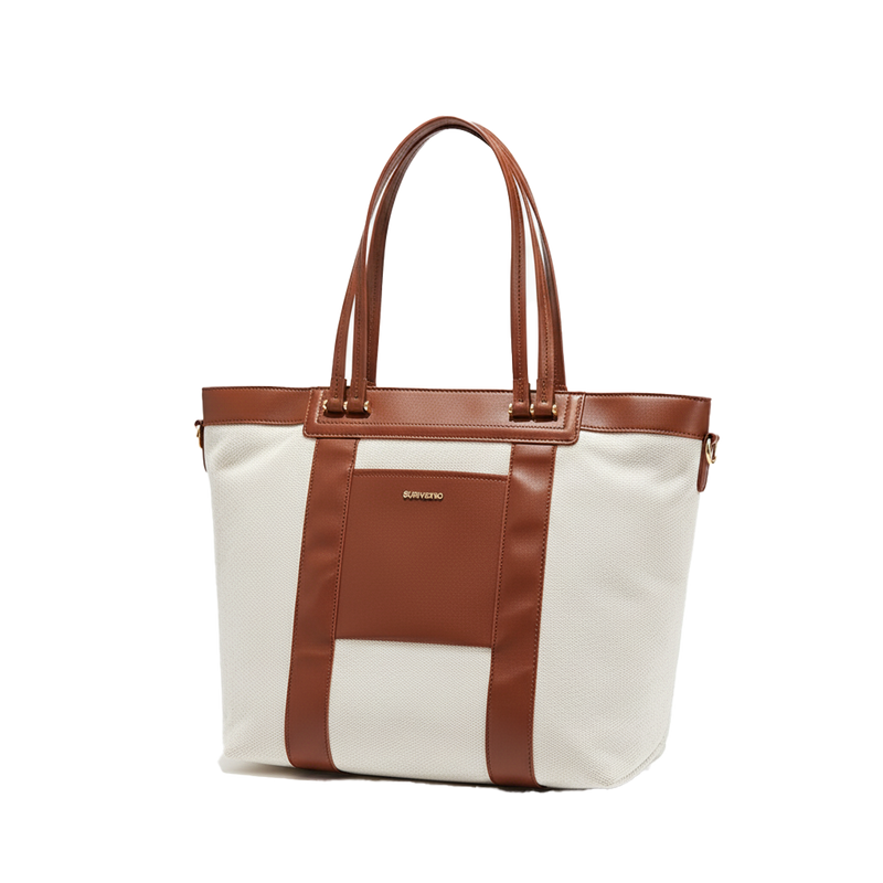 White convertible diaper tote bag with brown leather straps on a white background