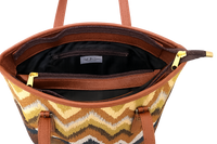 Woven tote with a chevron pattern and black interior on a white background