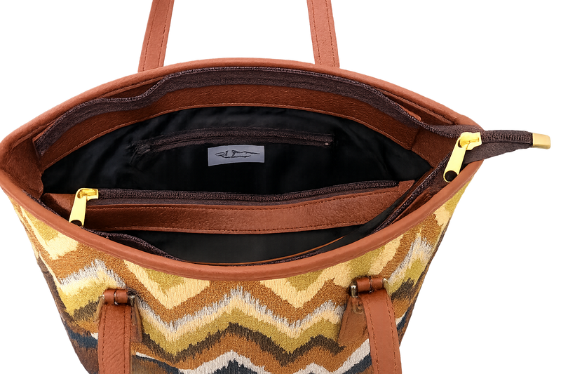 Woven tote with a chevron pattern and black interior on a white background