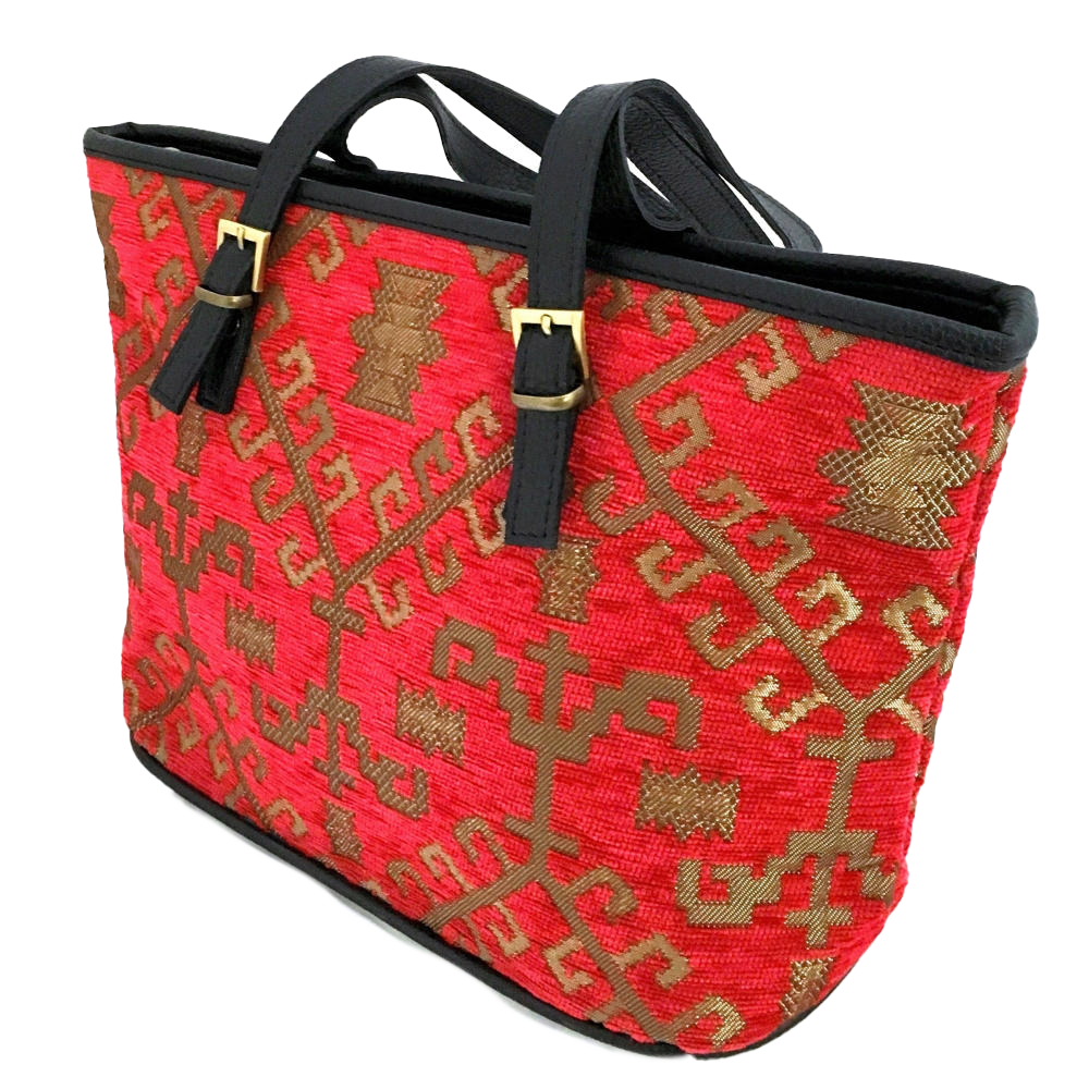 Red patterned woven tote with gold patterns and black handles on a white background