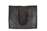 Dark brown leather tote bag on a white background