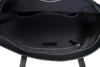 Close-up of a black backpack with visible zippers on a white background