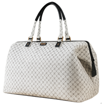 White quilted handbag with black handles and trim on a white background