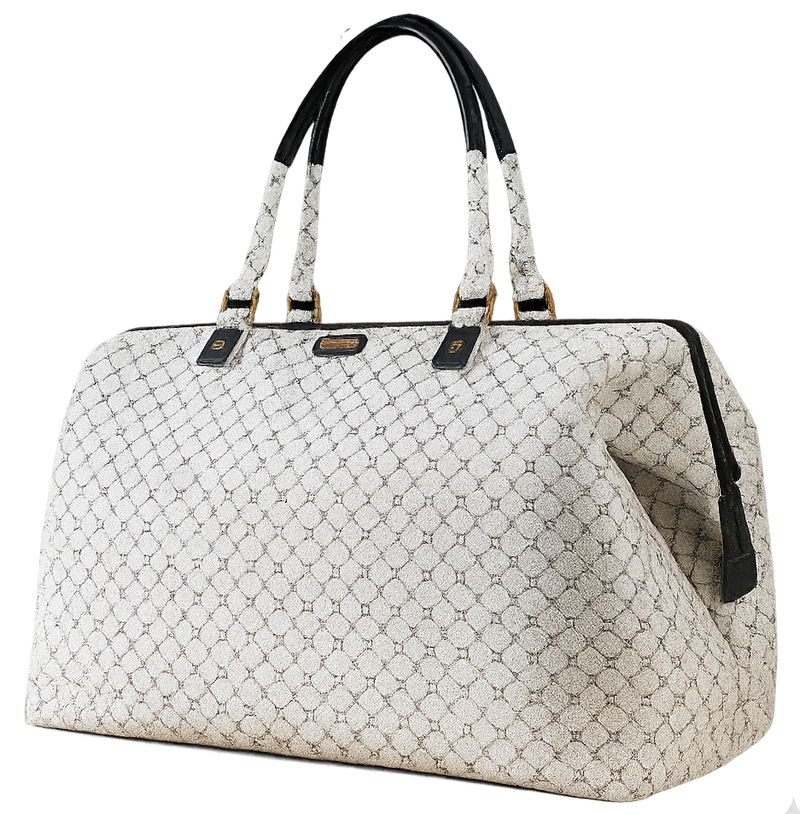 White quilted handbag with black handles and trim on a white background