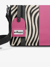 Tote with zebra pattern and pink accent, featuring a BYMANYC tag.