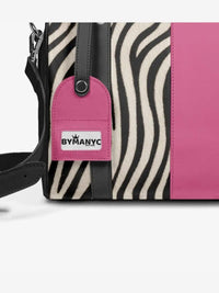 Tote with zebra pattern and pink accent, featuring a BYMANYC tag.