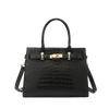 Black crocodile-patterned tote with gold hardware on a white background