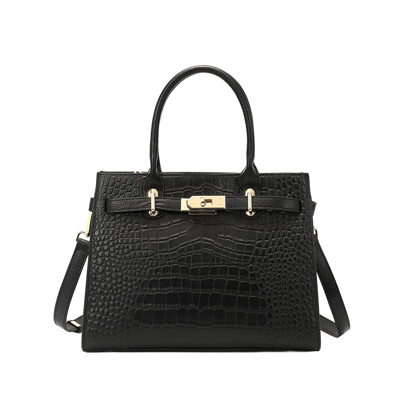 Black crocodile-patterned tote with gold hardware on a white background