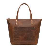 Brown leather tote bag with visible brand name on a white background