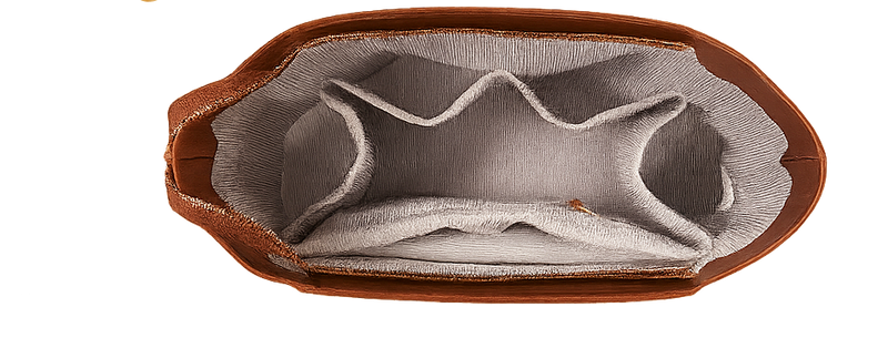Open brown leather case with compartments containing various items on a white background