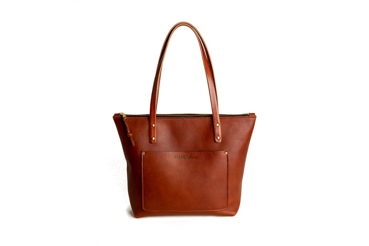 Brown leather tote bag on a white background