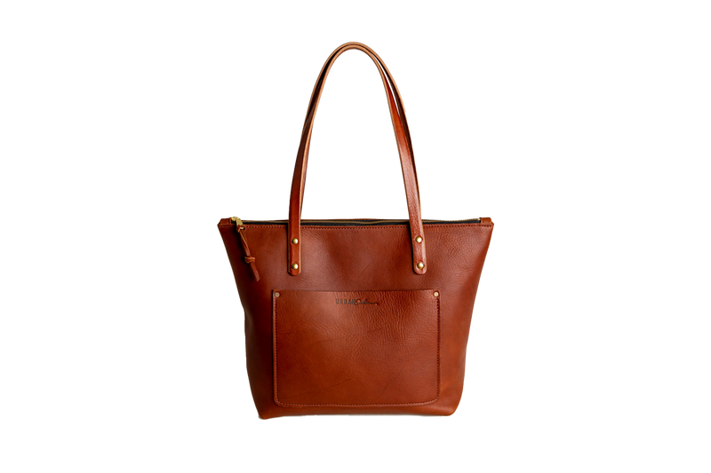 Cognac leather tote bag on a white background