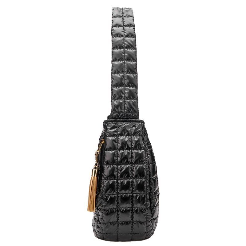 Black quilted crossbody bag with a gold tassel on a white background