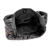 Black quilted bag with a white background