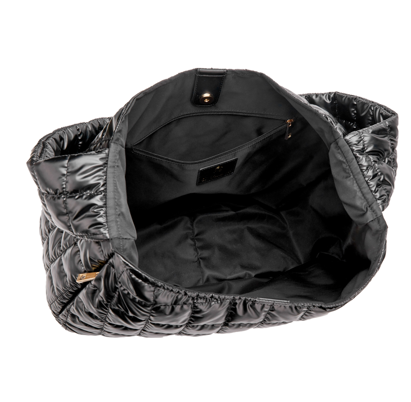 Black quilted bag with a white background